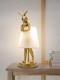Antique Gold Bunny Table Lamp With White Linen Shade