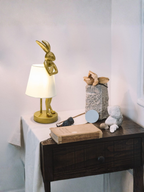 Antique Gold Bunny Table Lamp With White Linen Shade